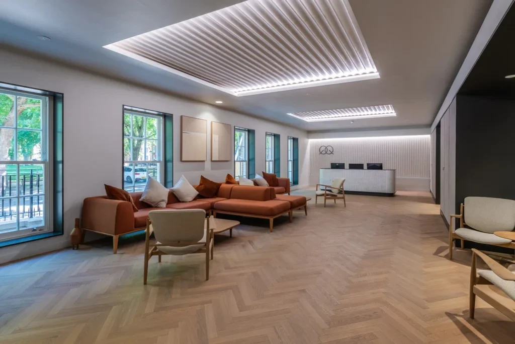Illuminated feature ceiling above a completed reception and seating space